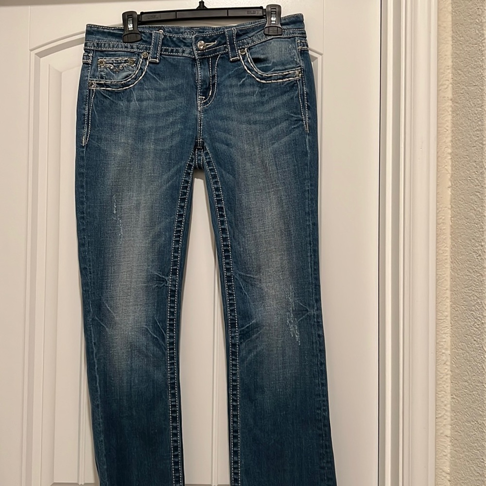 Miss Me blue jean, gently worn.